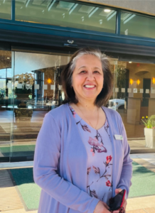 Employee at the entrance to a hotel lobby